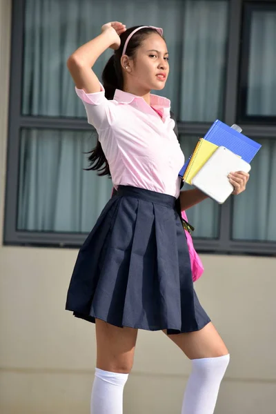 Filipina Girl Student Posing Wearing Uniform With Books