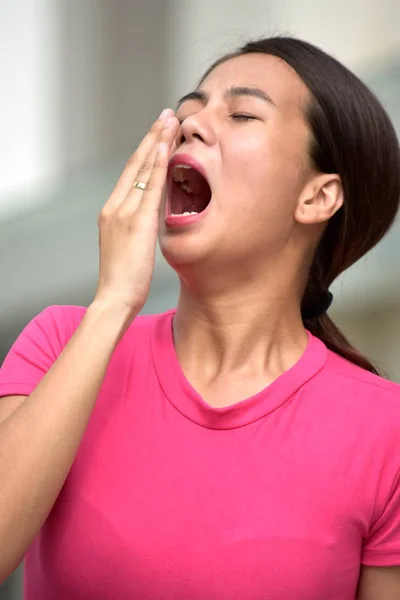 Attractive Asian Woman Yawning