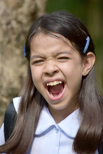Menina irritada estudante vestindo uniforme escolar — Fotografia de Stock