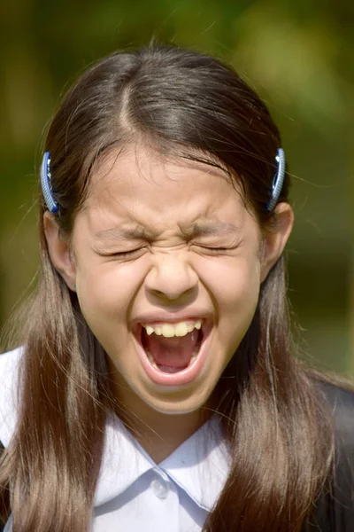 Stressoso studentessa indossa uniforme con libri — Foto Stock