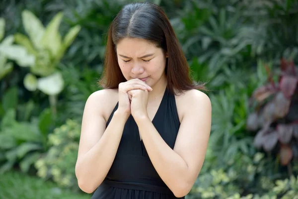A Young Diverse Woman Praying