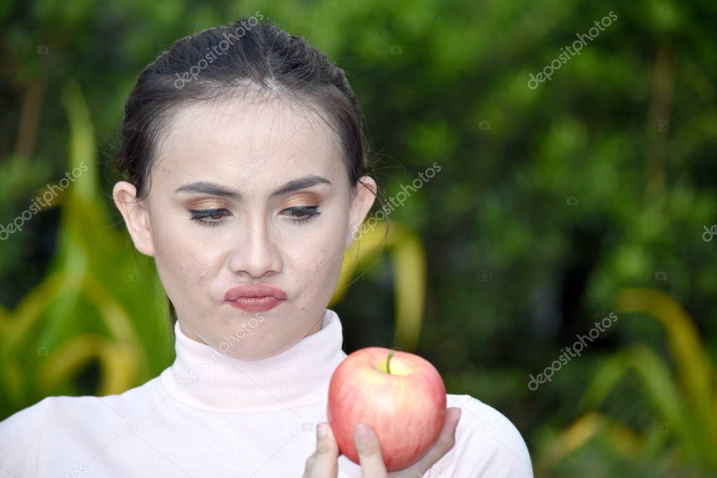 Youthful Diverse Female And Confusion With Apples