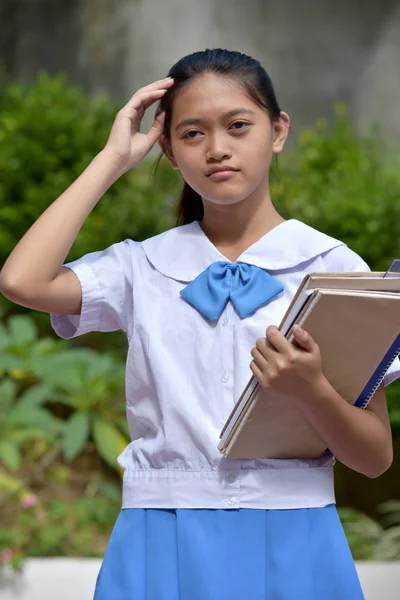 Una chica estudiante y confusión —  Fotos de Stock