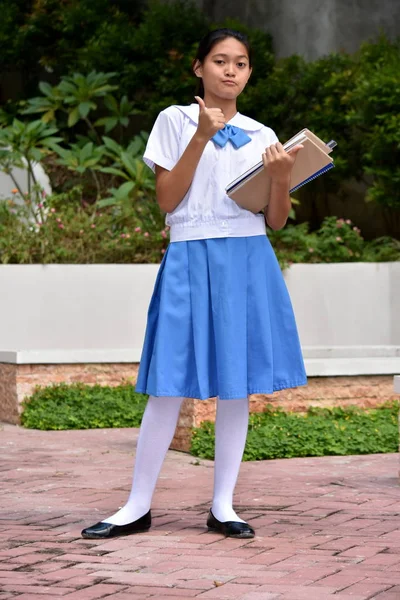 Proud Cute Asian Female Student With School Books