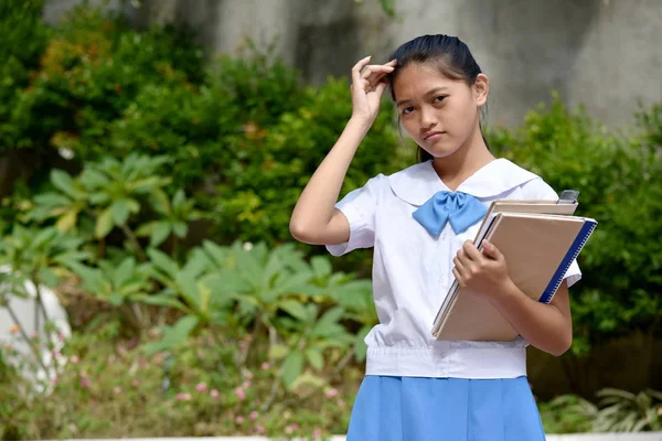 Confused Beautiful Diverse Girl Student With School Books