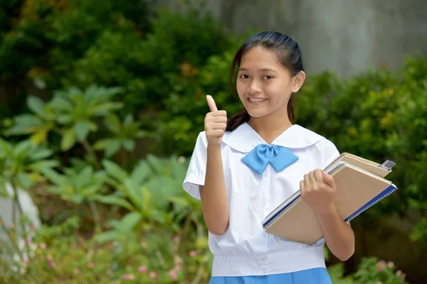 Hermosa asiática mujer estudiante con pulgares arriba con escuela libros — Foto de Stock