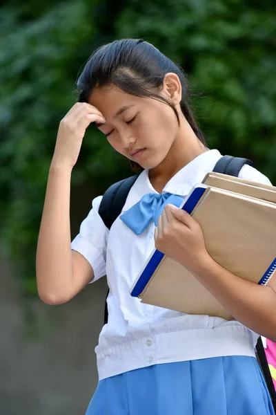 A Youthful Female Student And Sadness