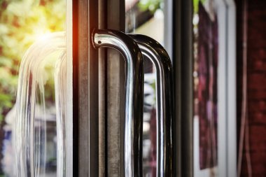 Stainless steel door handle with sunlight clipart