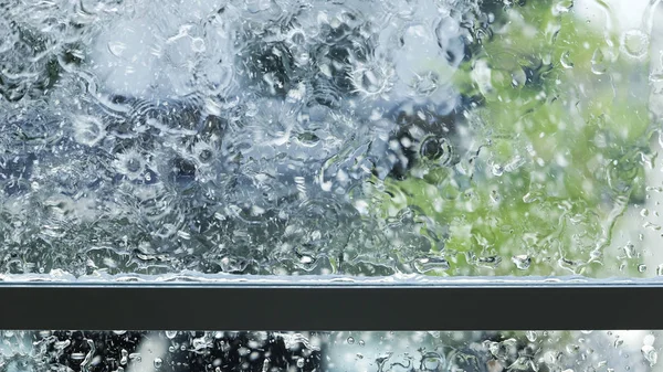 Water splash and rain drop on the window at home