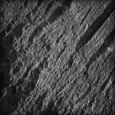 Taş yüzey dokusu. Koyu gri siyah arduvaz arka plan. 