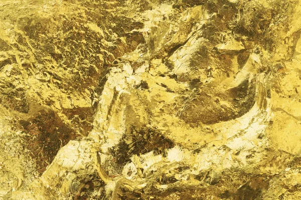 Parlak desenli altın yüzey, yakından. Altın külçelerinin desenli yüzeyi. Altın külçe arkaplan için yakın çekim
