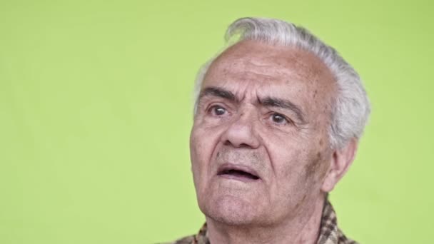 Senior Elderly Man Close Slow Motion Video Green Background — Stock Video