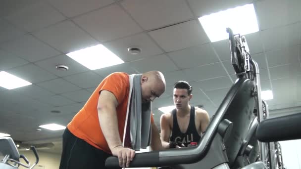 Fat Man Walking Treadmill Decisive Look Man's Handsome Young Coach ...