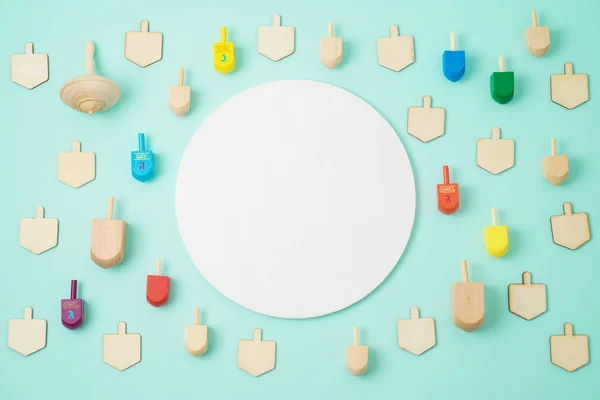 Jewish holiday Hanukkah background with dreidel  spinning tops. Top view from above. Flat lay