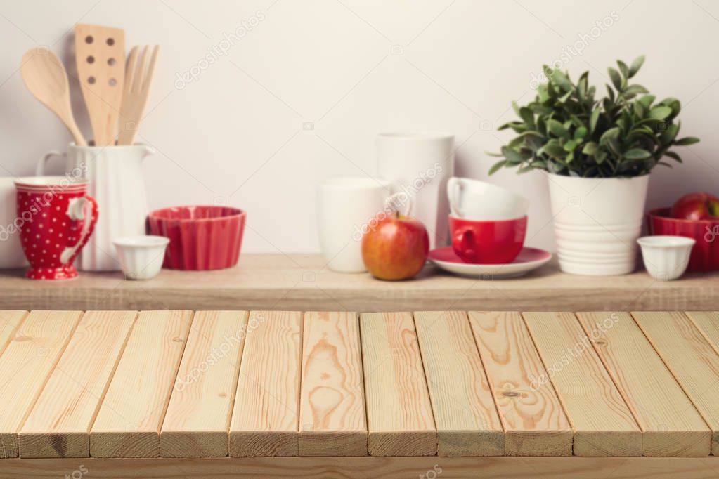 Empty wooden table over blurred kitchen shelf background. Can be used for food stand, key visual layout or new product advertising display