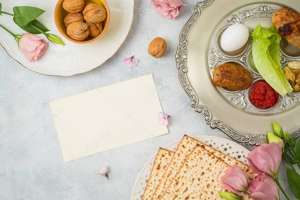 Jewish holiday Passover background with matzo, seder plate and s