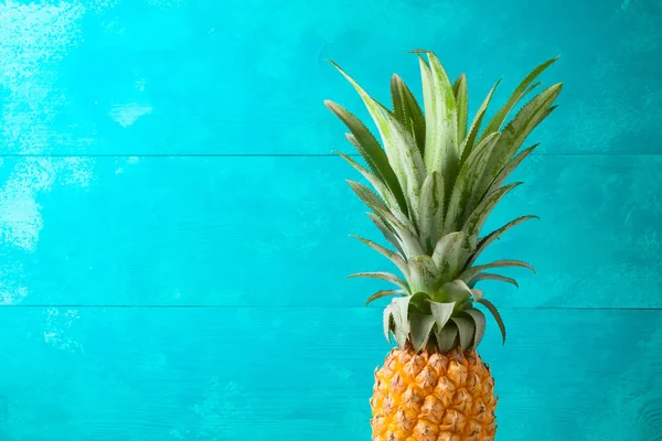 Summer concept with pineapple over blue wooden  background — Stock Photo, Image