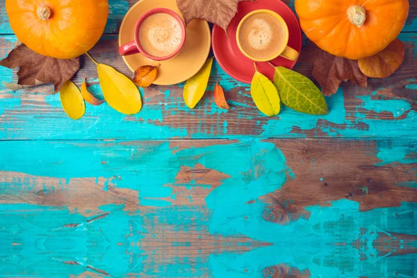 Autumn background with coffee cups, fall leaves and pumpkin on w — Stock Photo, Image