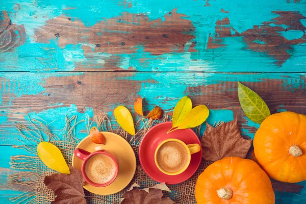 Autumn background with coffee cups, fall leaves and pumpkin on w — Stock Photo, Image