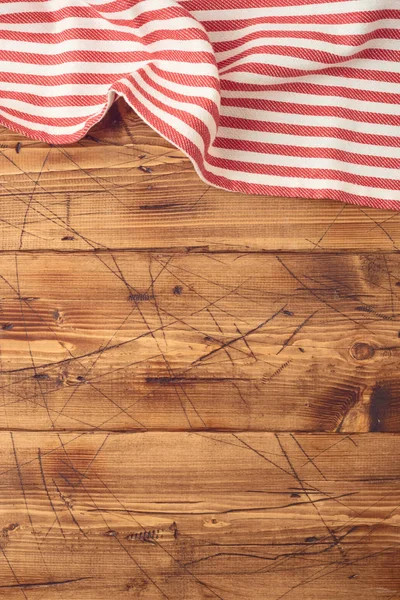 Wooden tabletop with striped tablecloth for kitchen or cooking f — Stock Photo, Image