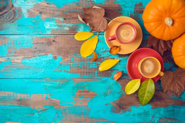 Autumn background with coffee cups, fall leaves and pumpkin on w — Stock Photo, Image