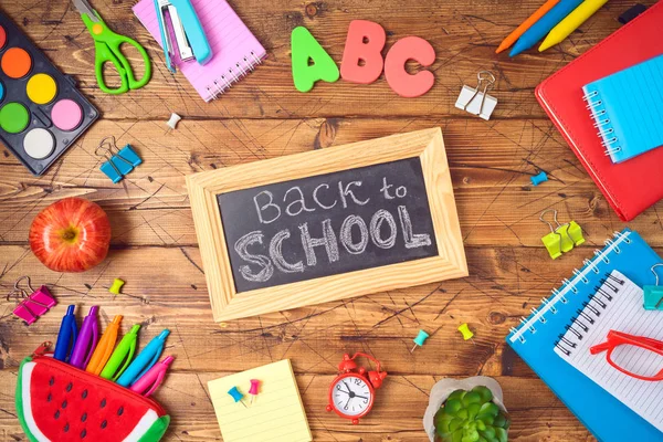 Back to school background with school supplies on wooden table. — Stock Photo, Image