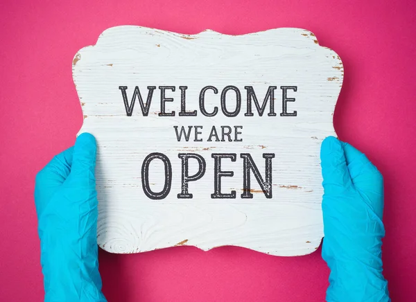 Welcome Open Wooden Sign Hands Blue Medical Gloves Cafe Restaurant — Stock Photo, Image