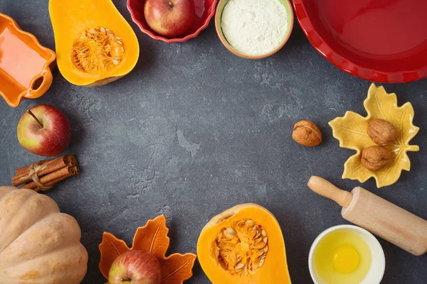 Thanksgiving day cooking and baking background with apples and pumpkin pie ingredients