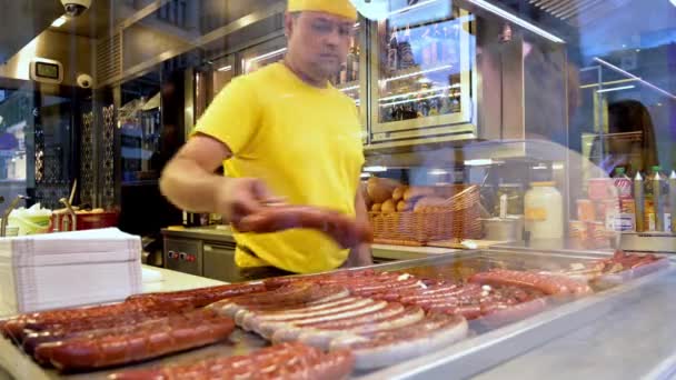 Vienna July 2019 Man Arranges Cooked Sausages Display Shop Window — Stock Video