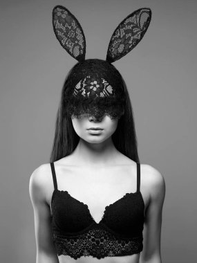 Beautiful Sexy Girl in Lace Mask. masquerade Young Woman in funny Bunny Ears mask. Halloween