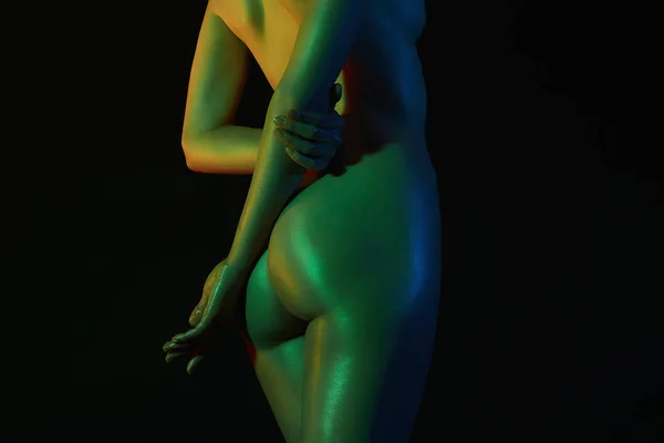 女性背部。裸体女人在五颜六色的明亮的灯光 — 图库照片