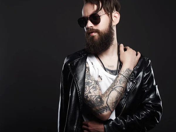 Fashionable tattooed handsome man in sunglasses — Stock Photo, Image