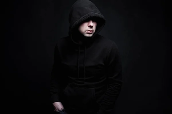 Man in Hood. Boy in a hooded sweatshirt
