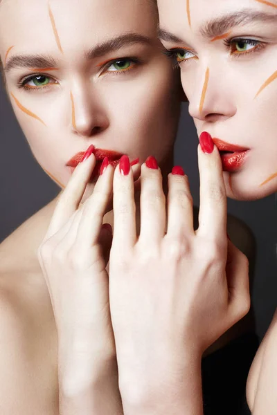 Beautiful Girl in Paint looking in the mirror — Stock Photo, Image