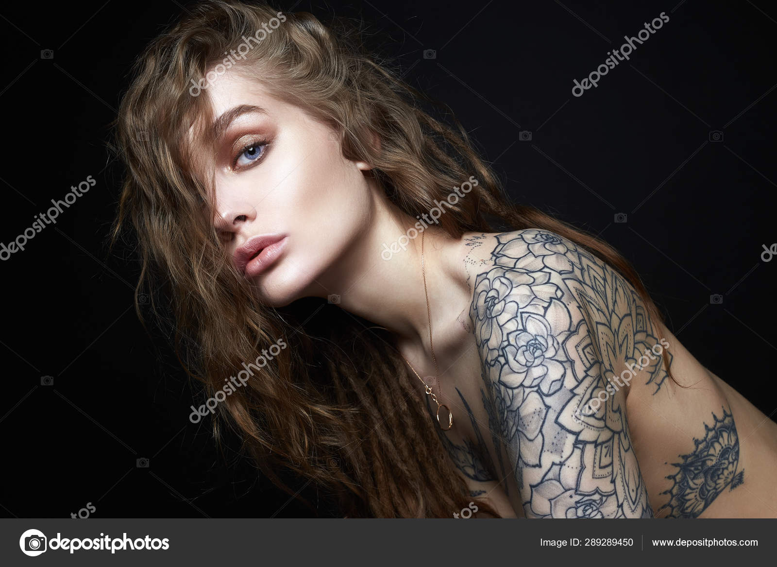 Sexy Young Woman with Tattoo. Stock Photo by ©EugenePartyzan 289289450 Sexy Young Woman with Tattoo. Stock Photo by ©EugenePartyzan 289289450