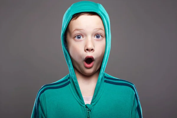 Little boy in hood. enjoy grimace emotion kid — Stok fotoğraf