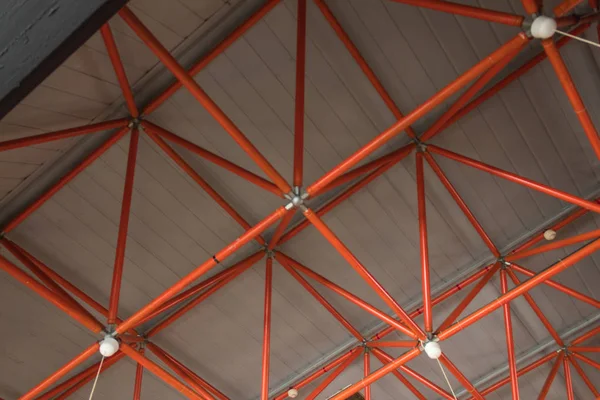 factory ceiling made of red ceiling pipes