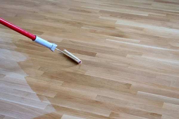 Varnishing Lacquering Oak Parquet Floor Paint Roller First Layer Stock Picture