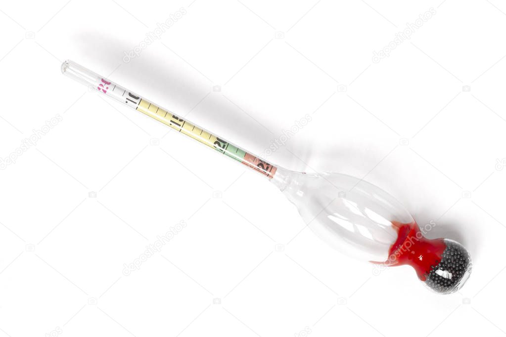 Glass gauge hydrometer refractometer for measuring of a residual sugar concentration in wine isolated on white. With a clipping path.