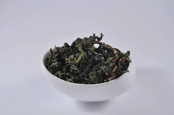 Çay ware Çin yeşil çay. Kuru çay yaprağı. Çin çay ürün fotoğraf. Çay ve infüzyon. Kuru çay yığını.