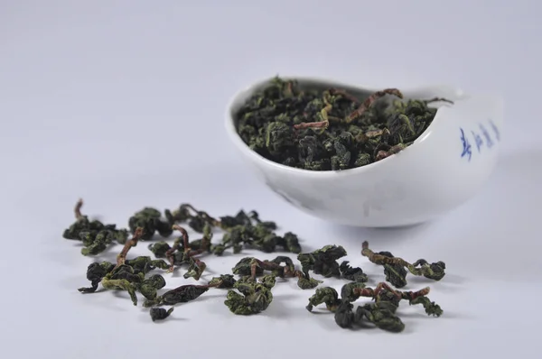Çay ware Çin yeşil çay. Kuru çay yaprağı. Çin çay ürün fotoğraf. Çay ve infüzyon. Kuru çay yığını.