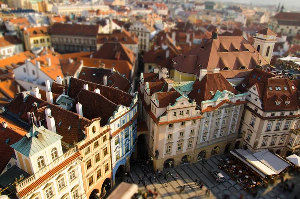 View of Old town square with people crowd, old buildings with red tiled roofs and old streets in the stare mesto from platform of Old Town Hall (Staromestska Radnice), Prague, Czech Republic