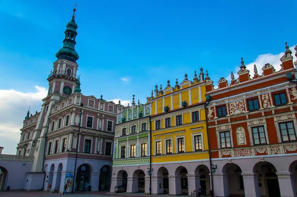 Town Hall on Great Market Square and row of old colourful buildings in the center of Zamosc city (The Pearl of Renaissance, UNESCO World Heritage), Poland
