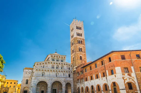Duomo di San Martino San Martin cathedral facade and bell tower in historical centre of medieval town Lucca in beautiful summer day with blue sky background, Tuscany, Italy