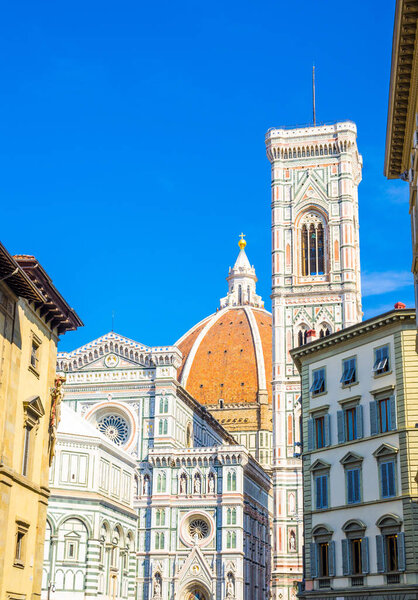 Florence Duomo, Cattedrale di Santa Maria del Fiore, Basilica of Saint Mary of the Flower Cathedral with bell tower, Battistero di San Giovanni in sunny day with clear blue sky, Tuscany, Italy