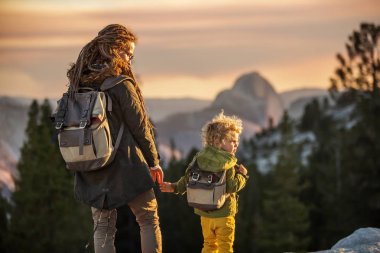 Mother with son visit Yosemite national park in California clipart