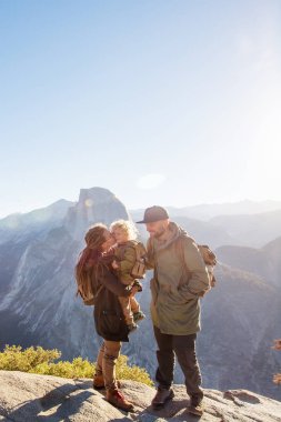 Happy family visit Yosemite national park in California clipart