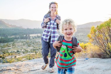 Mother with son visit Yosemite national park in California clipart