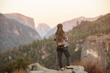 Hiker woman visit Yosemite national park in California clipart