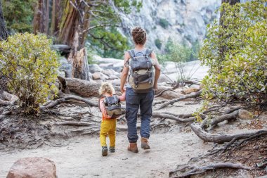 Mother with  son visit Yosemite national park in California clipart